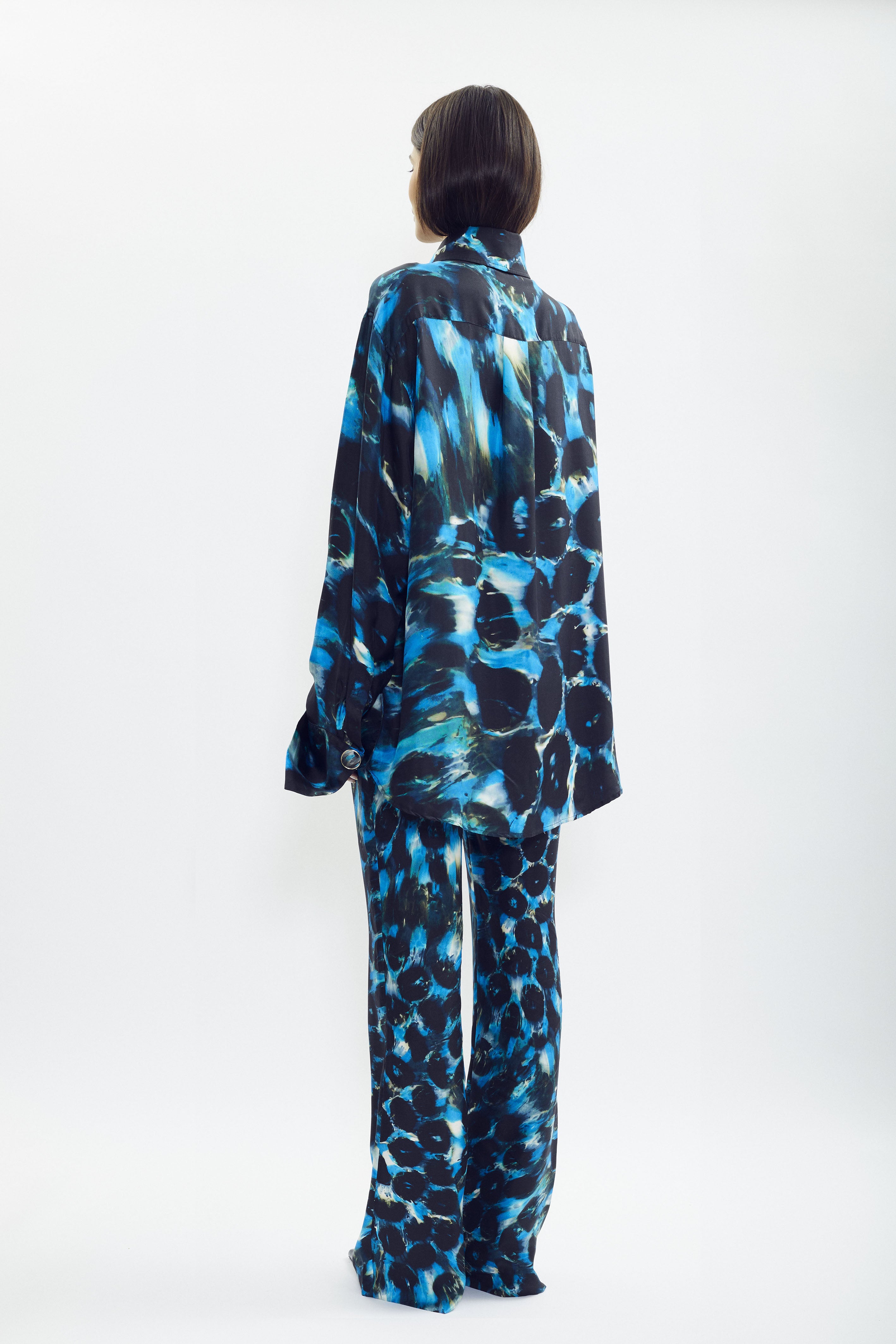 Silk shirt with SONNEY’s signature print and green accents, flowing oversized fit