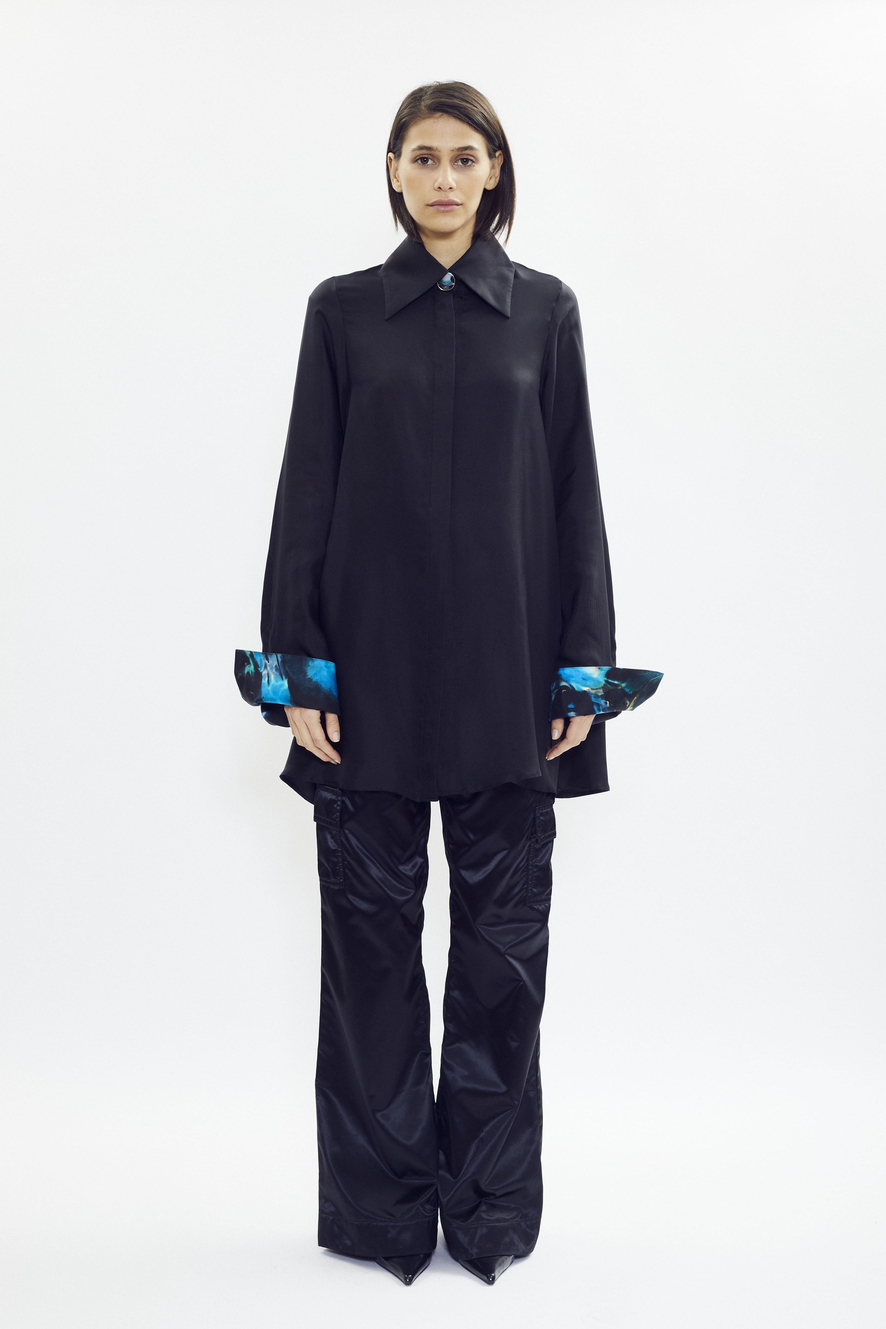 Black silk shirt with subtle signature print inside collar and cuffs, oversized fit