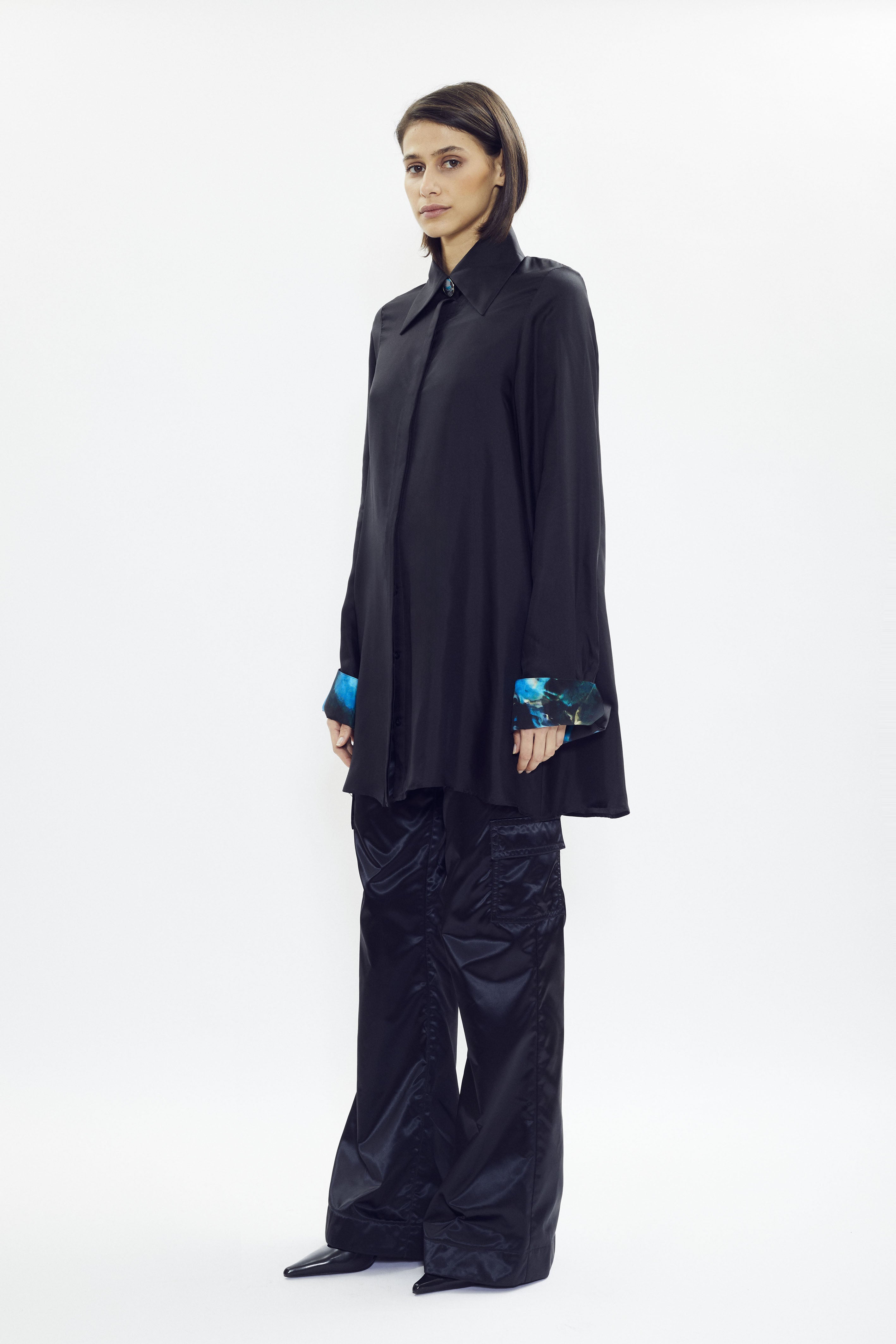 Black silk shirt with subtle signature print inside collar and cuffs, oversized fit